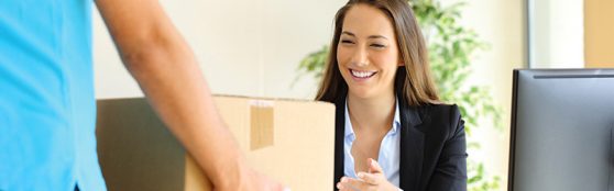 Woman smiling receiving package