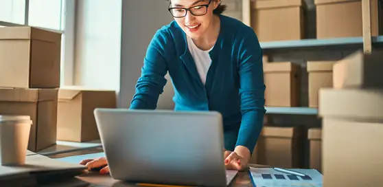 person using computer to calculate shipping costs 