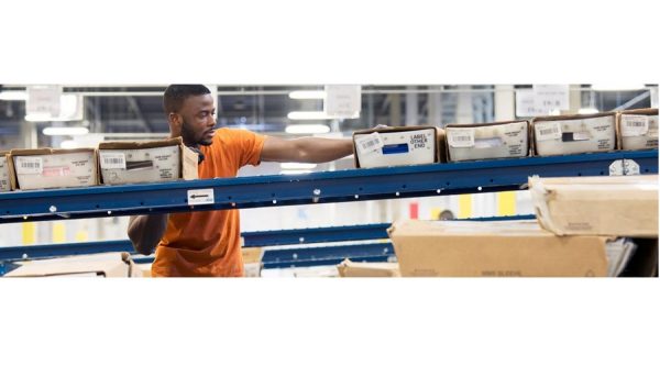 man sorting packages in a warehouse